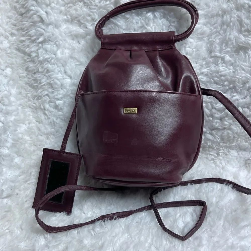 Buxton Buxhyde Burgundy small crossbody bag with padded pocket.